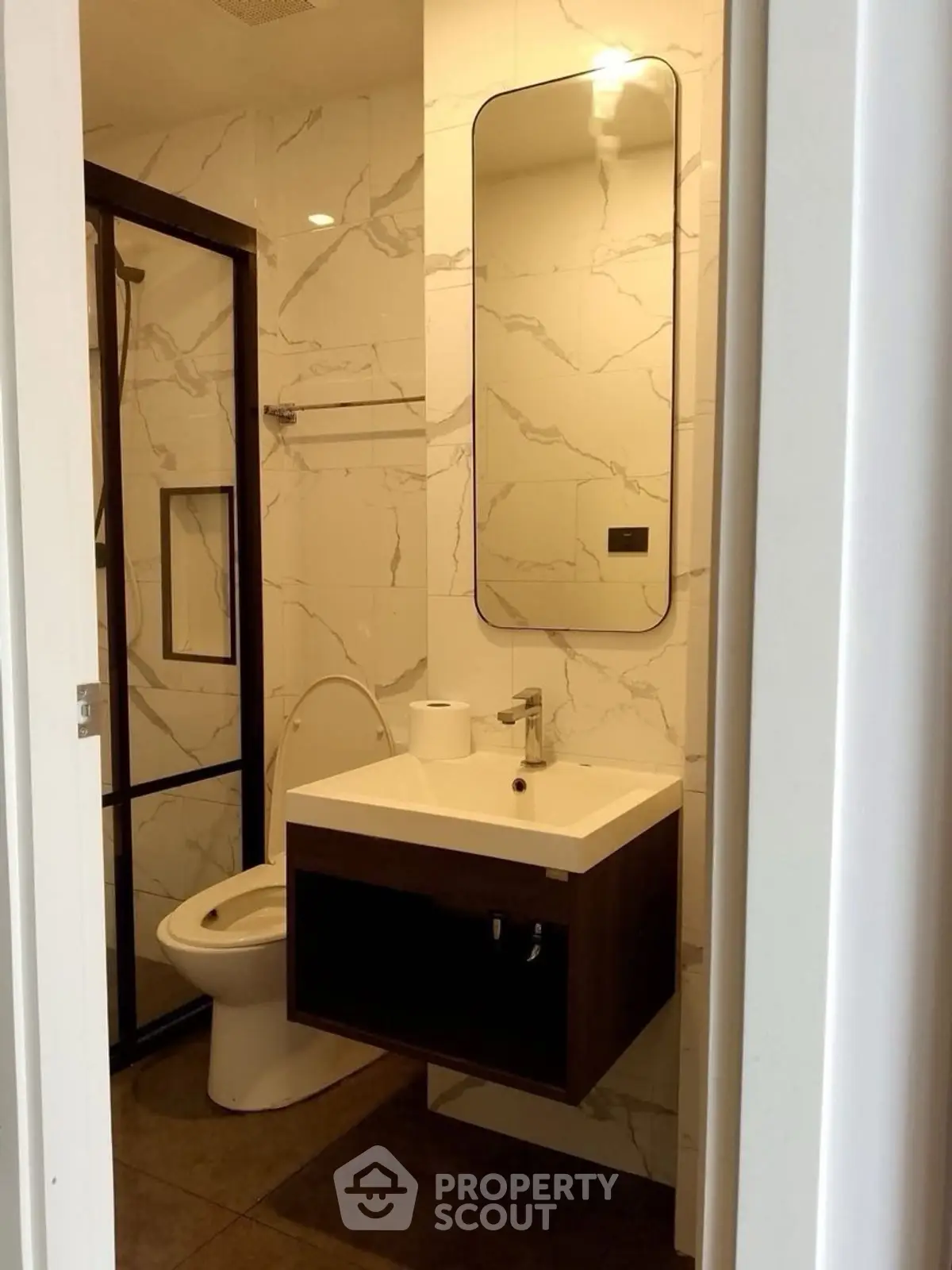 Modern bathroom with sleek vanity and marble tiles
