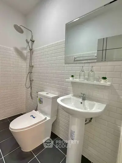 Modern bathroom with sleek fixtures and white subway tiles
