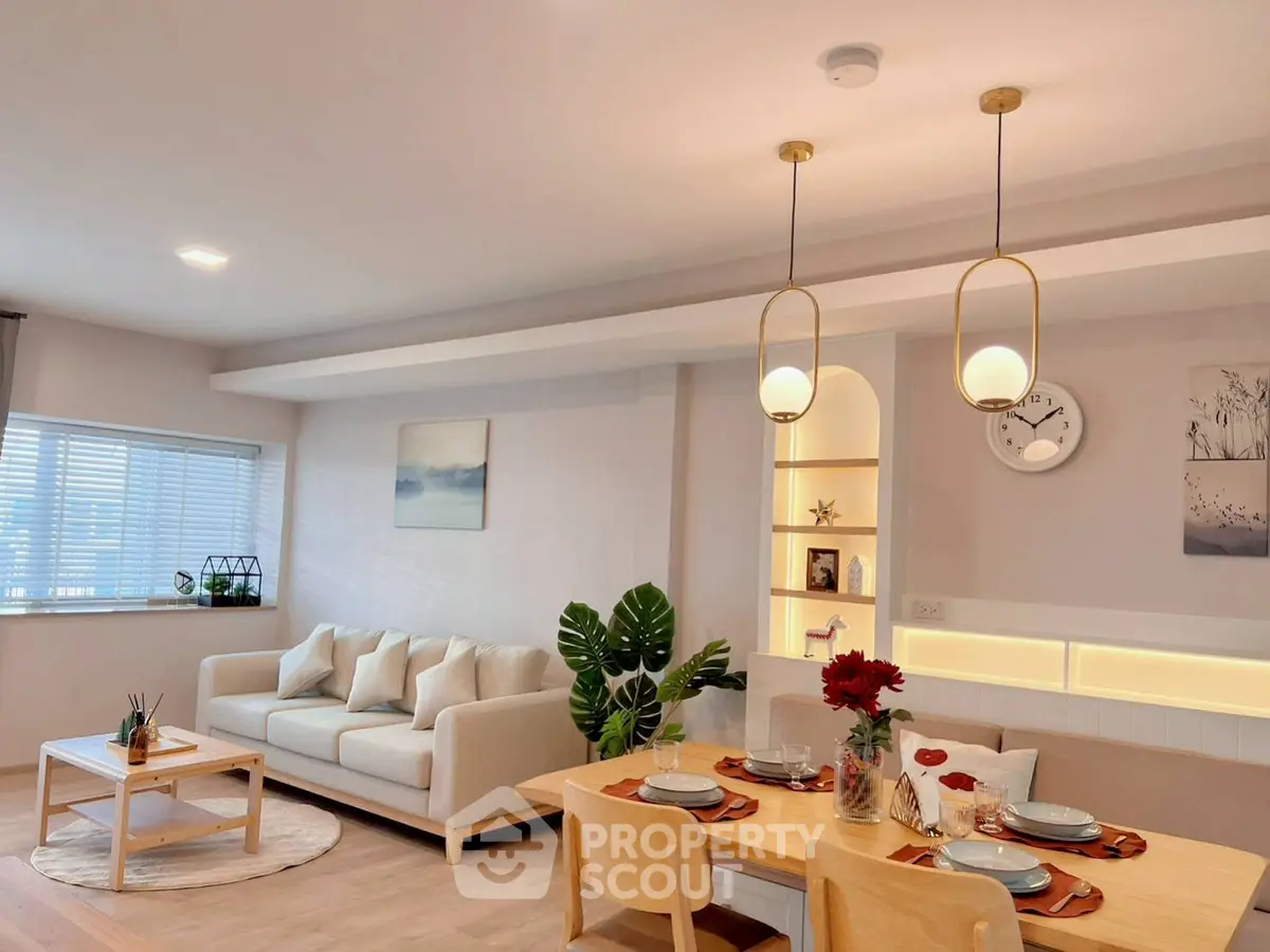 Stylish modern living room with cozy dining area and elegant lighting