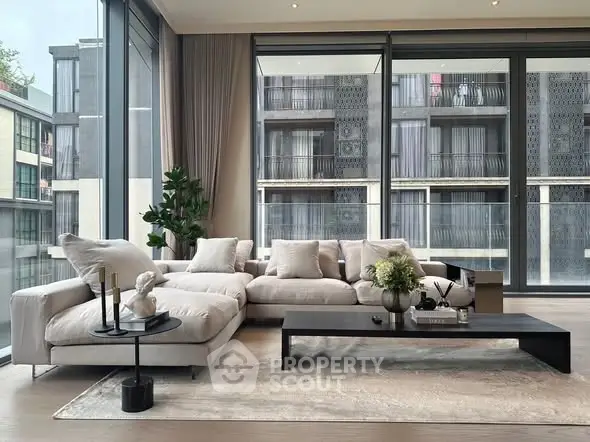 Luxurious modern living room with floor-to-ceiling windows and elegant decor