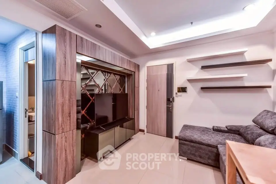 Modern living room with sleek design and cozy furniture in a stylish apartment.