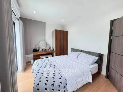 Cozy bedroom with modern wooden furniture and natural light