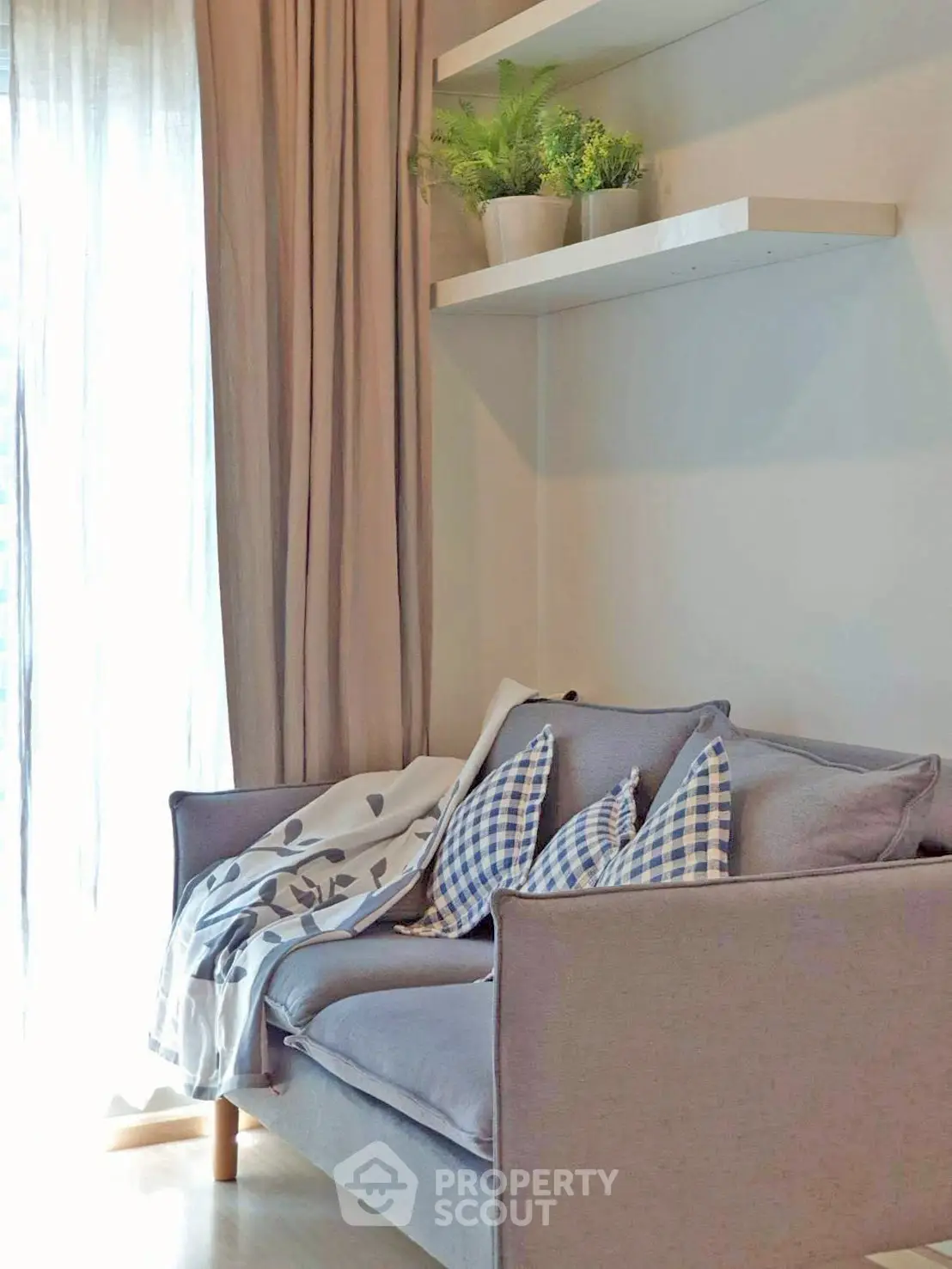 Cozy living room corner with stylish sofa and natural light