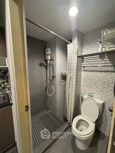 Modern bathroom with shower and toilet in compact layout