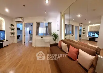 Spacious modern living room with hardwood floors and stylish decor
