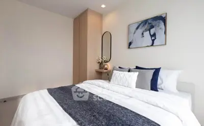 Modern bedroom with stylish decor and cozy bedding