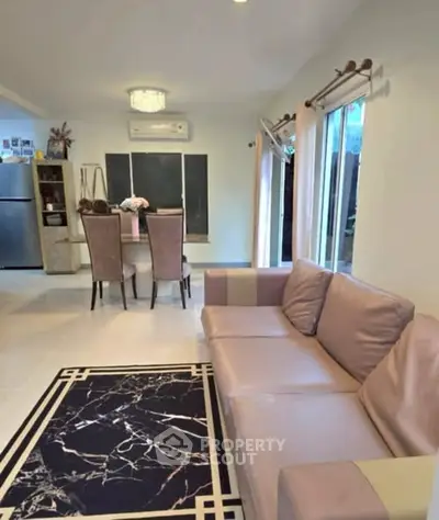 Stylish living room with elegant dining area and modern decor