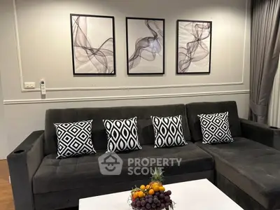 Stylish living room with modern decor and plush sofa, perfect for relaxation and entertaining.