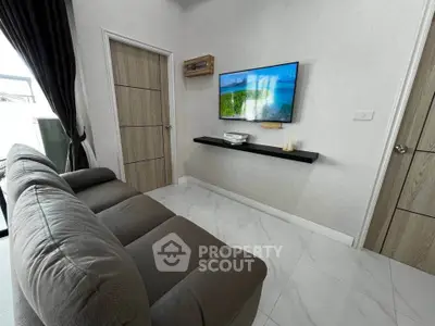 Modern living room with sleek design and wall-mounted TV