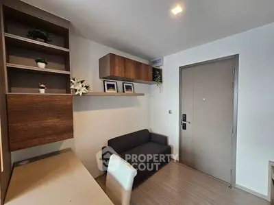 Modern living room with sleek furniture and stylish decor in a contemporary apartment.