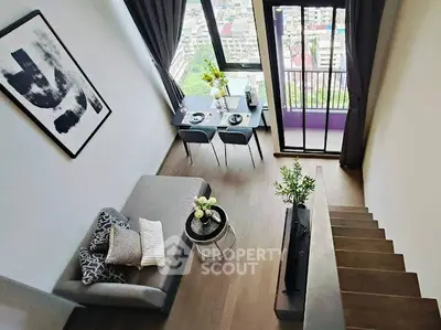 Modern loft apartment with stylish decor and city view balcony.