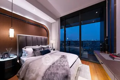 Luxurious bedroom with stunning city view and elegant decor