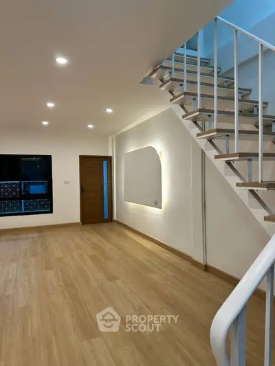 Modern duplex interior with wooden flooring and stylish staircase