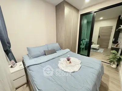 Cozy modern bedroom with blue bedding and stylish decor