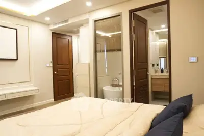 Modern bedroom with ensuite bathroom and stylish decor