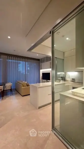 Luxurious open-plan living room with modern kitchen and elegant furnishings