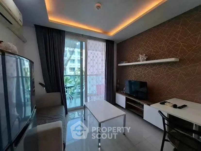 Modern living room with balcony access and stylish decor