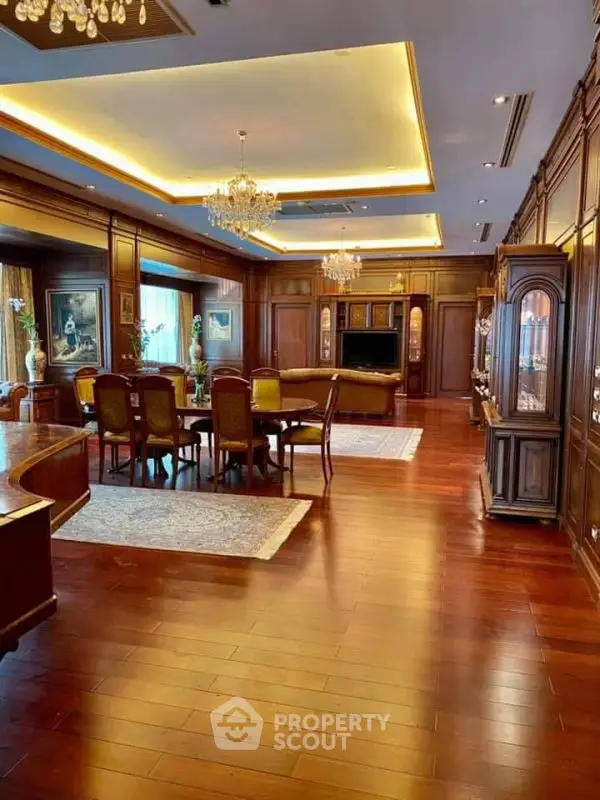 Luxurious living room with elegant wooden flooring and chandeliers