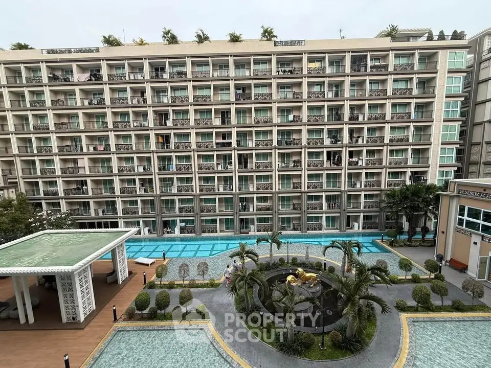 Luxurious apartment complex with pool and landscaped garden view