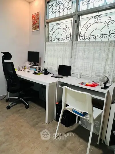 Modern study room with dual workstations and ergonomic chairs