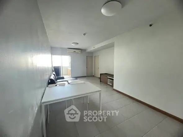 Spacious minimalist living room with modern furniture and natural light