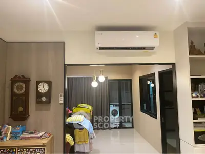 Modern bedroom with air conditioning and washing machine view