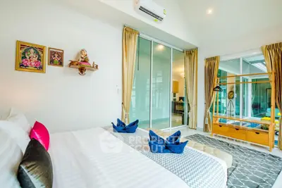 Spacious modern bedroom with elegant decor and large windows