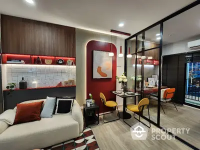 Modern living room with stylish decor and open dining area, featuring contemporary furniture and vibrant accents.