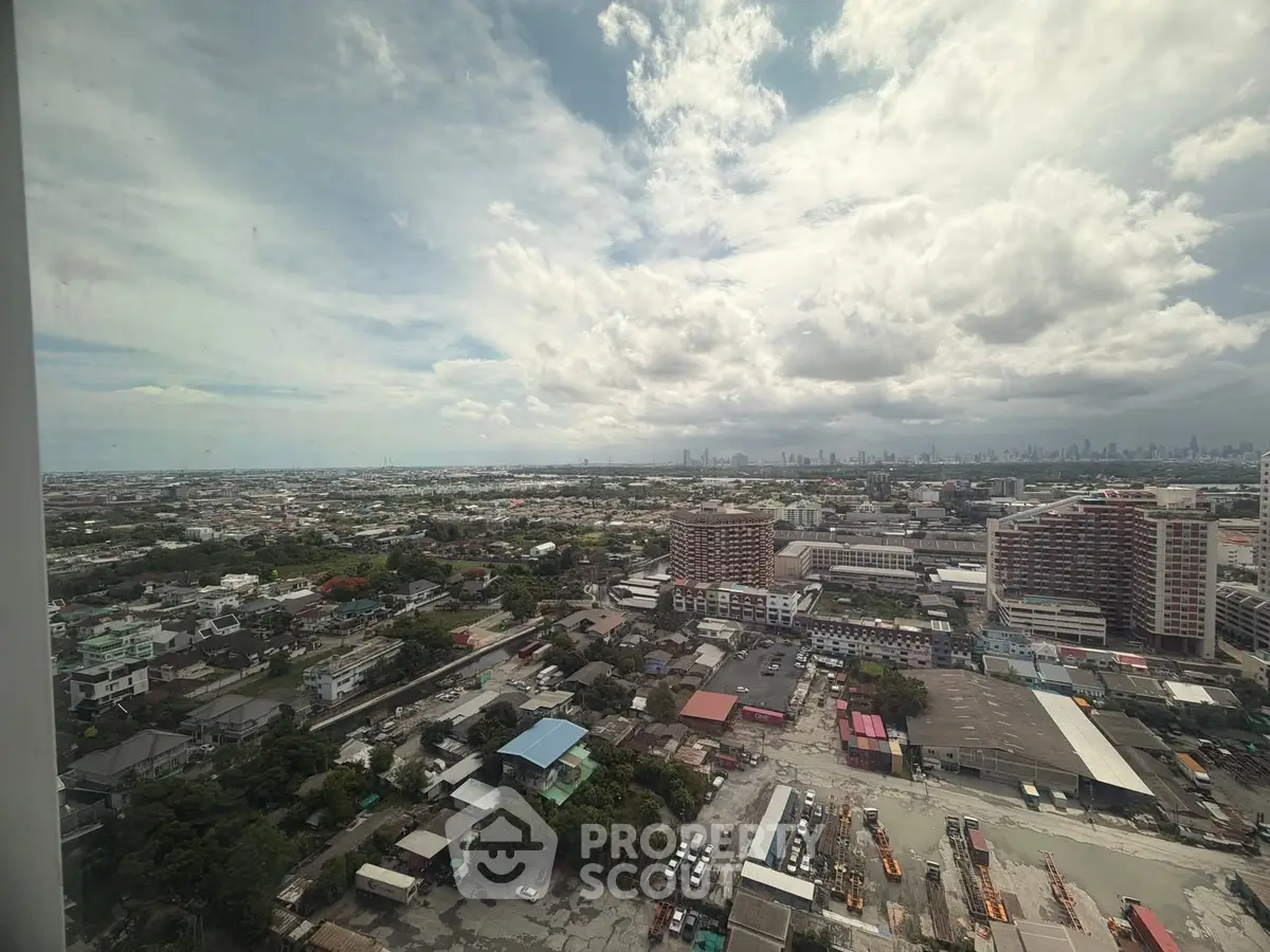 Stunning panoramic cityscape view from high-rise building, showcasing urban landscape and distant skyline.