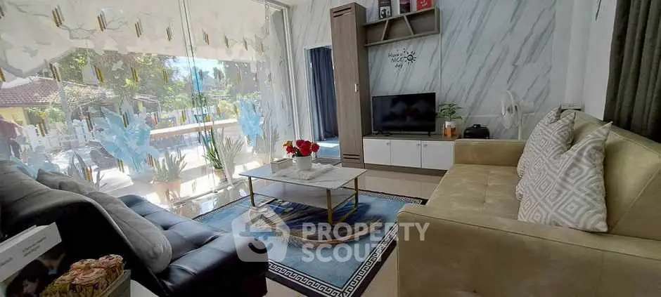 Luxurious living room with modern decor and garden view