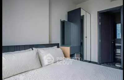 Modern bedroom with sleek design and mirrored wardrobe