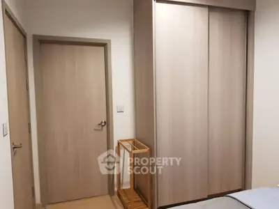 Modern bedroom with wooden wardrobe and minimalist design