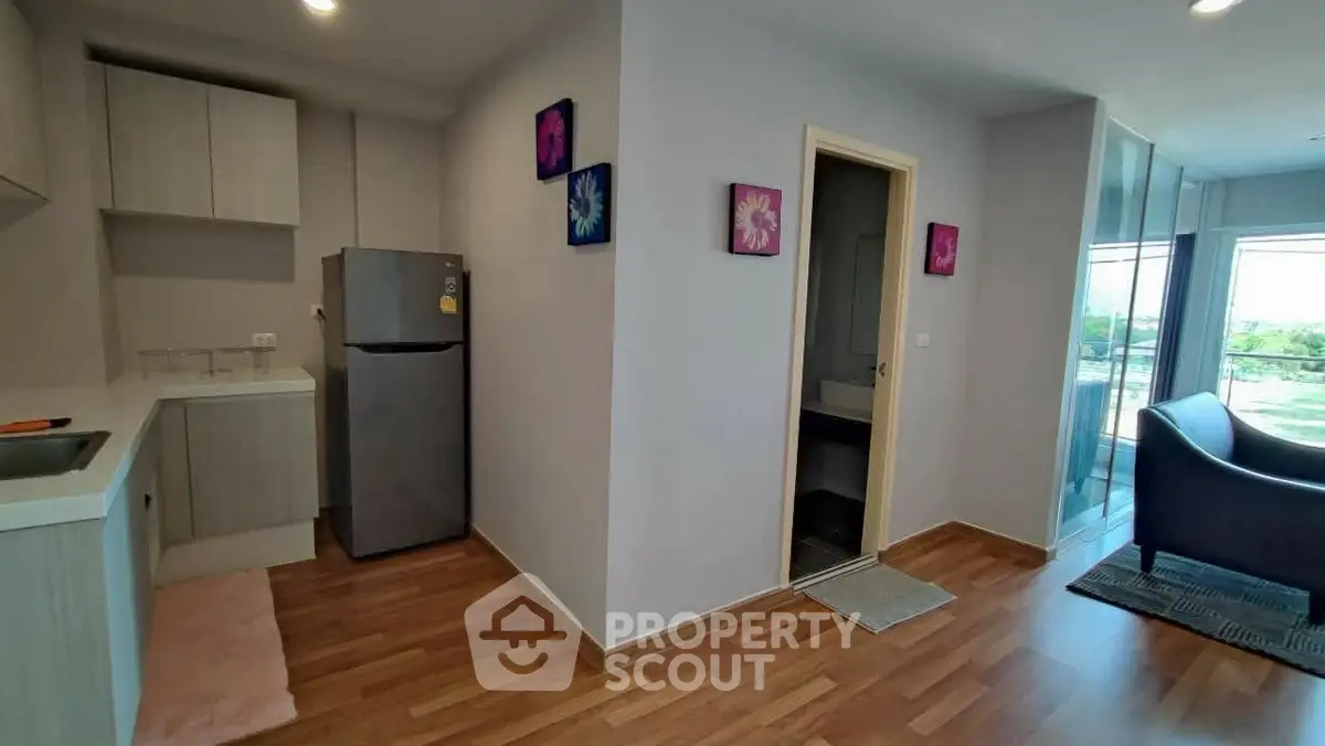 Modern apartment interior with kitchen and balcony view