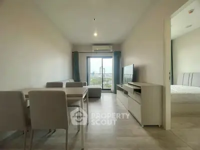 Modern apartment living room with dining area and balcony view