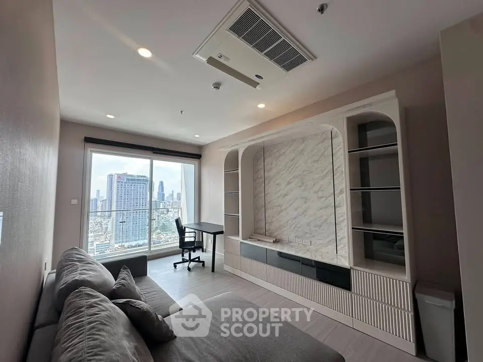 Modern living room with city view, featuring stylish built-in shelves and cozy seating area.