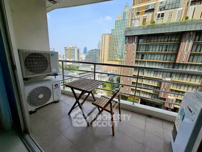 Charming balcony with city view, perfect for relaxation and enjoying the skyline.