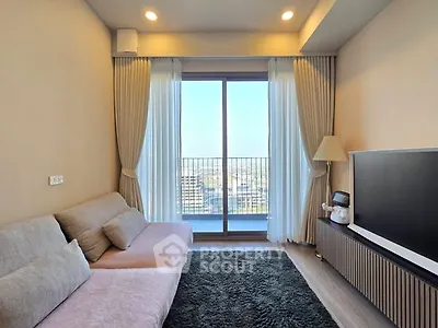 Modern living room with large window and city view, featuring cozy sofa and sleek TV setup.