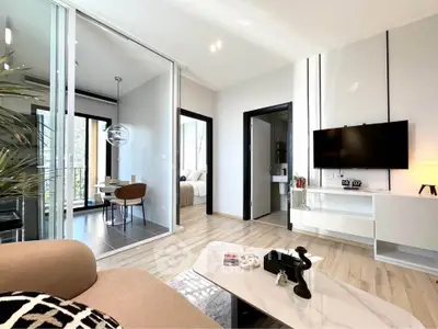 Modern living room with sleek design, open layout, and stylish decor in a contemporary apartment.