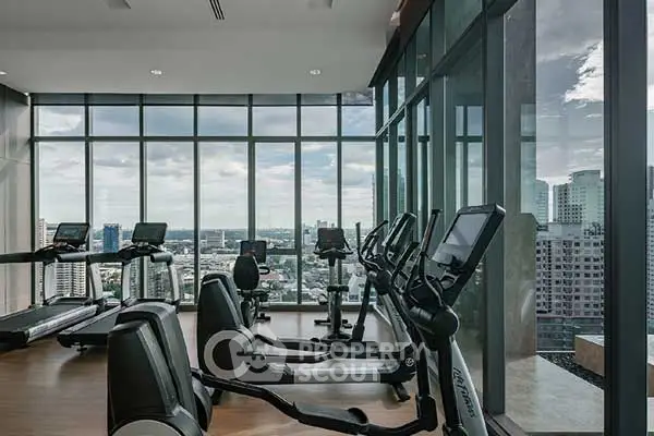 Modern gym with panoramic city views and state-of-the-art equipment.