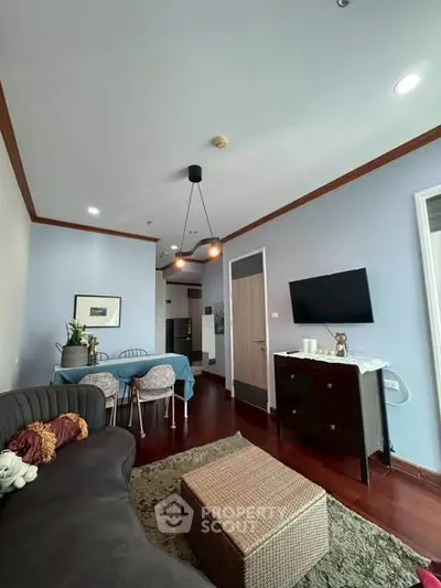 Charming living room with modern decor and cozy seating area, perfect for relaxation and entertainment.