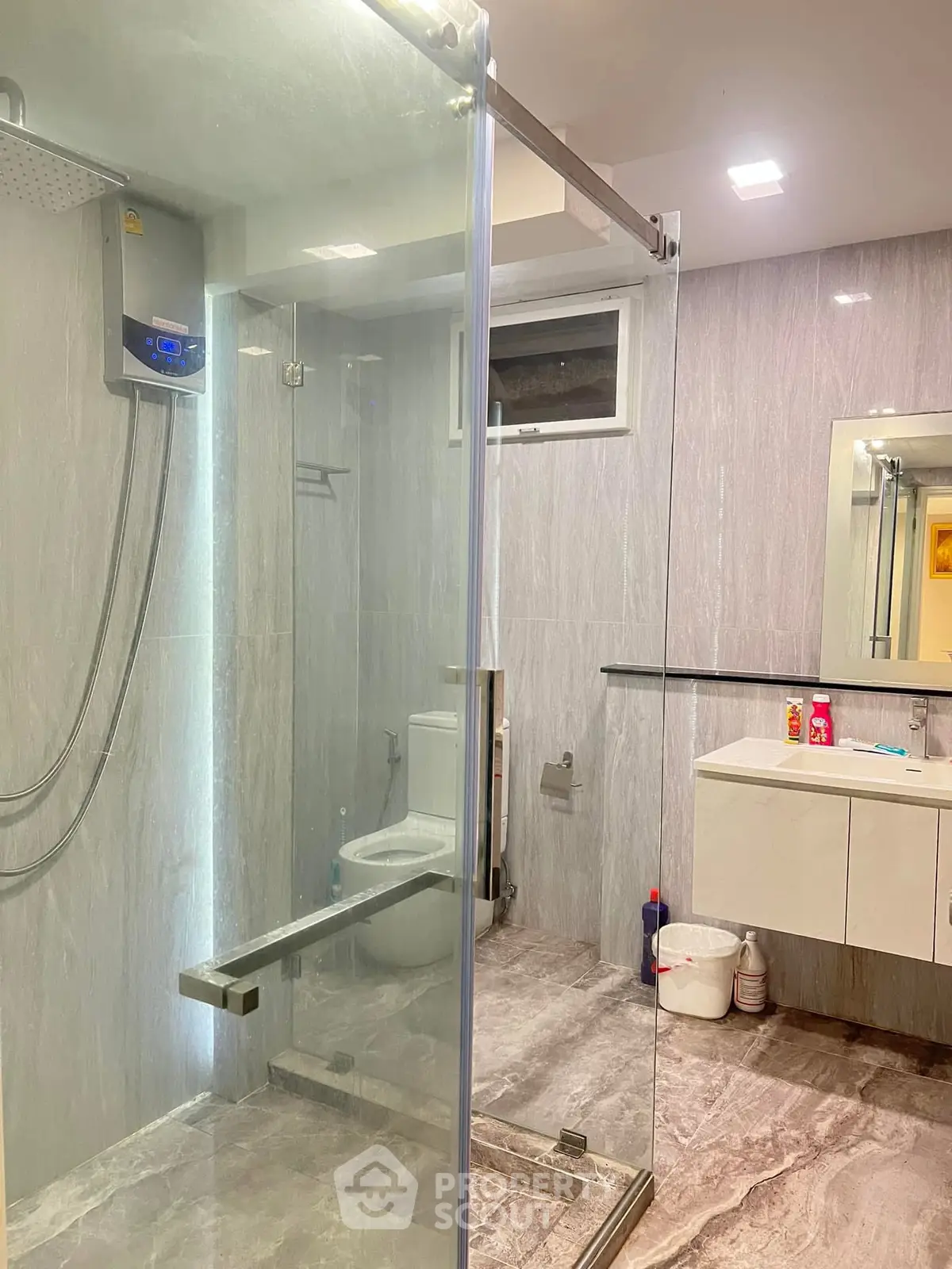 Modern bathroom with glass shower and sleek vanity