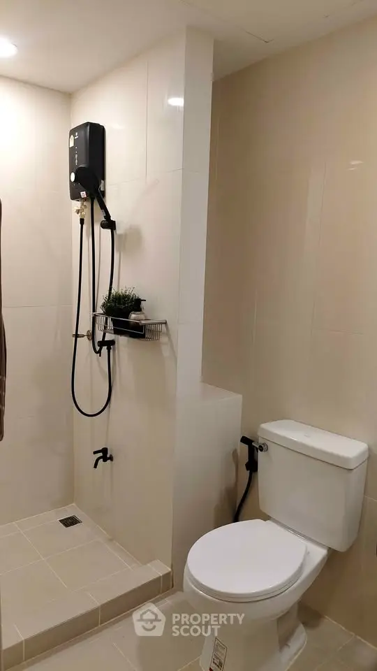 Modern bathroom with shower and toilet in sleek design