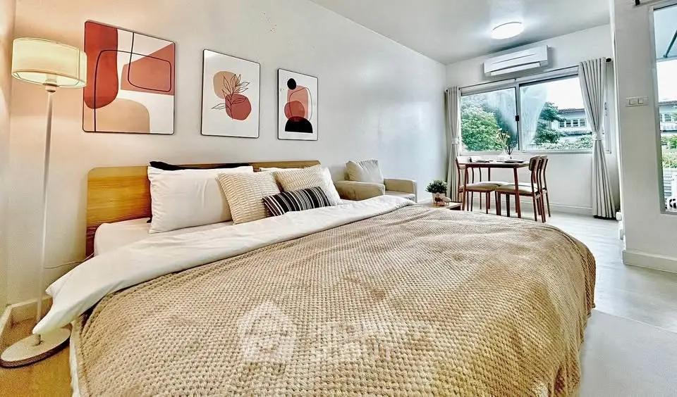Modern bedroom with cozy decor and natural light