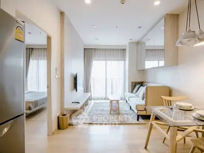 Modern open-plan living room with natural light and stylish decor