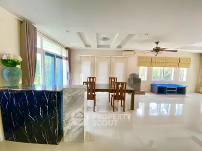 Spacious living room with elegant dining area and modern decor