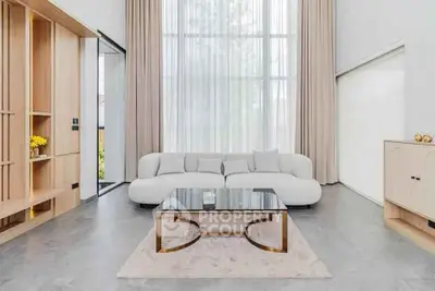 Luxurious modern living room with high ceilings and elegant decor