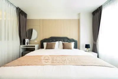 Luxurious bedroom with elegant decor and ample natural light, featuring a plush bed and stylish curtains.