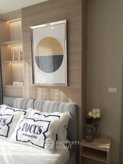 Modern bedroom with stylish decor and natural light