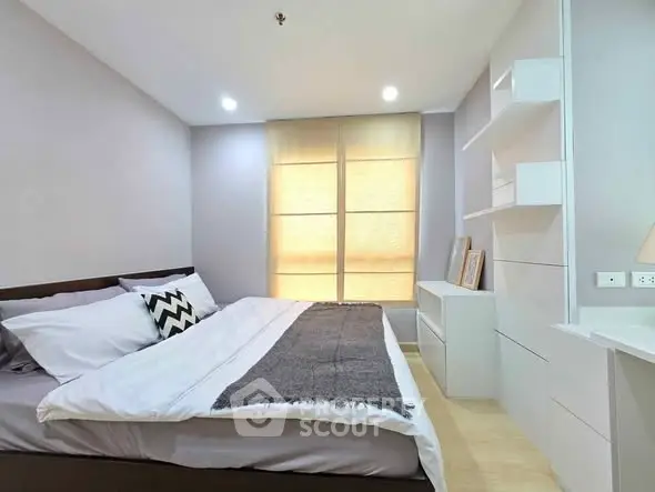 Modern bedroom with stylish decor and ample natural light