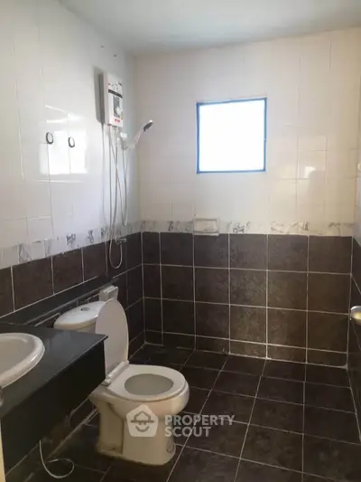 Spacious bathroom with modern fixtures and natural light